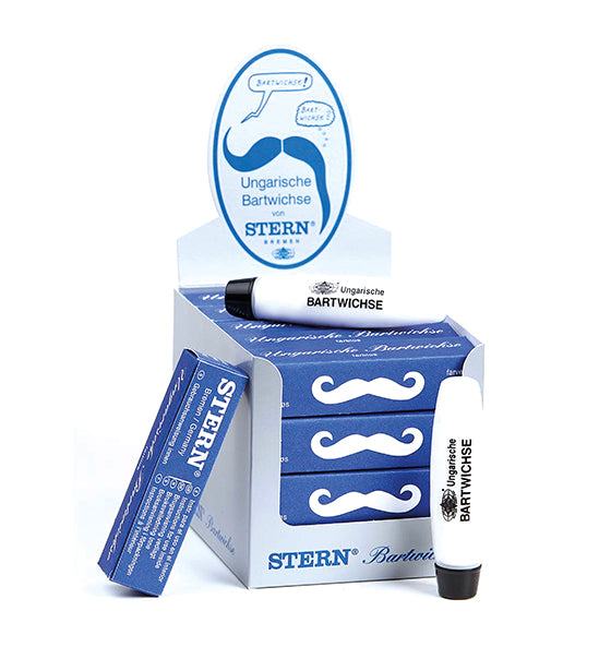 Ungarische Bartwichse Stern in weißer Tube mit blauer Verpackung zur Bartpflege und Styling, dargestellt im Verkaufsdisplay mit Schnurrbart-Symbol.