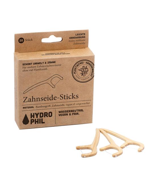 Zahnseide Sticks aus Bambus von Hydrophil, umweltfreundlich und plastikfrei, mit reißfester Nylon-Zahnseide, vegan und wasserneutral.