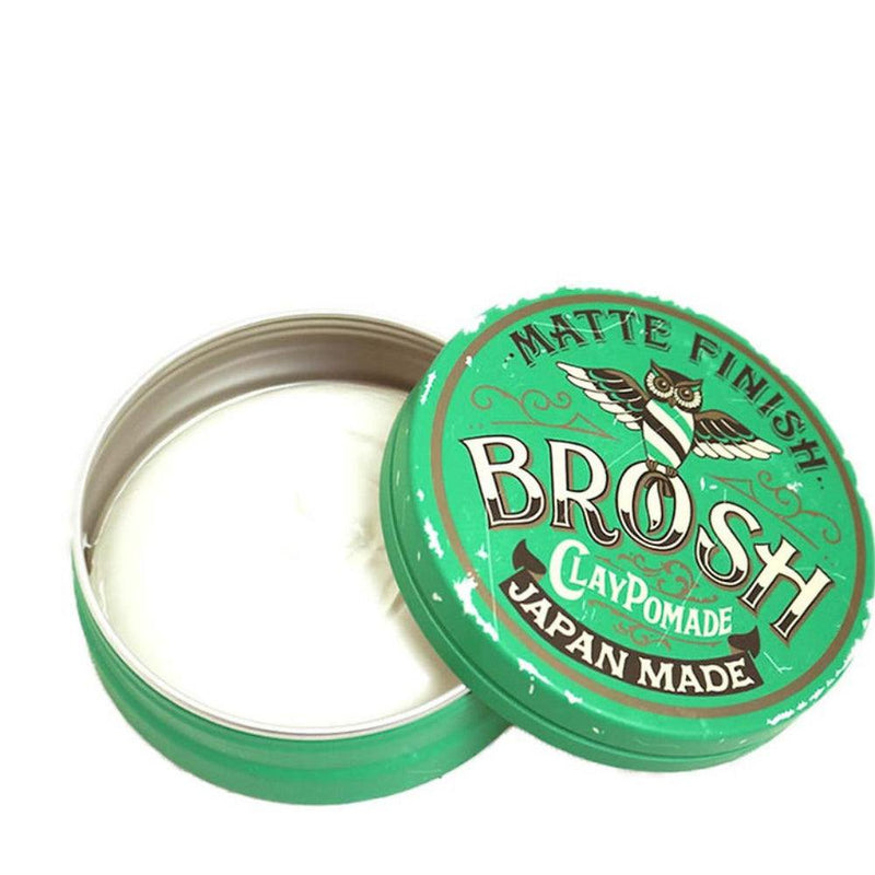 Haarpomade Clay Pomade Brosh mit mattem Finish in grünem runden Behälter geöffnet