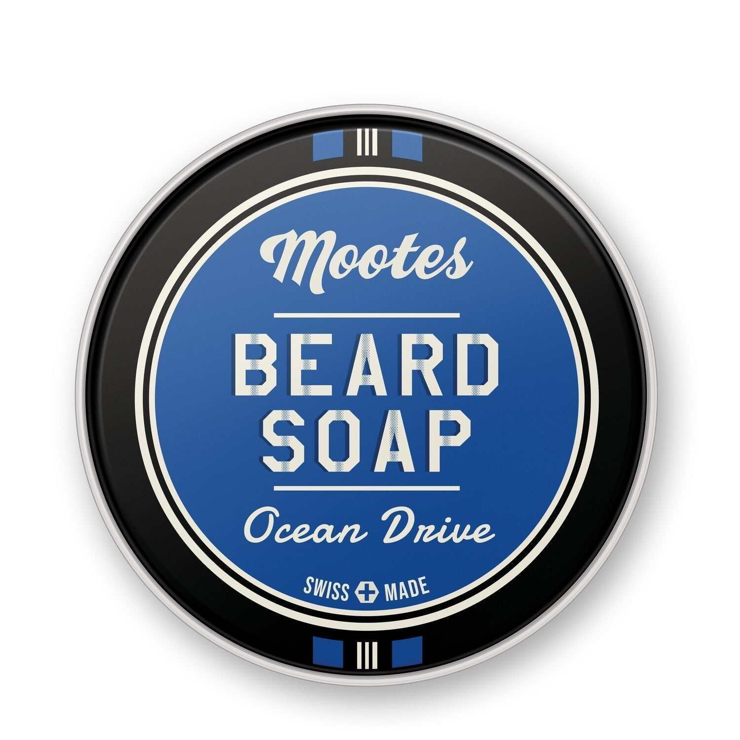 Runde schwarze Dose mit blauer Front der Bart- und Duschseife Ocean Drive - Mootes, schweizer Naturkosmetik für Bartpflege mit Aloe vera, Edelweiss und sommerlichem Duft.