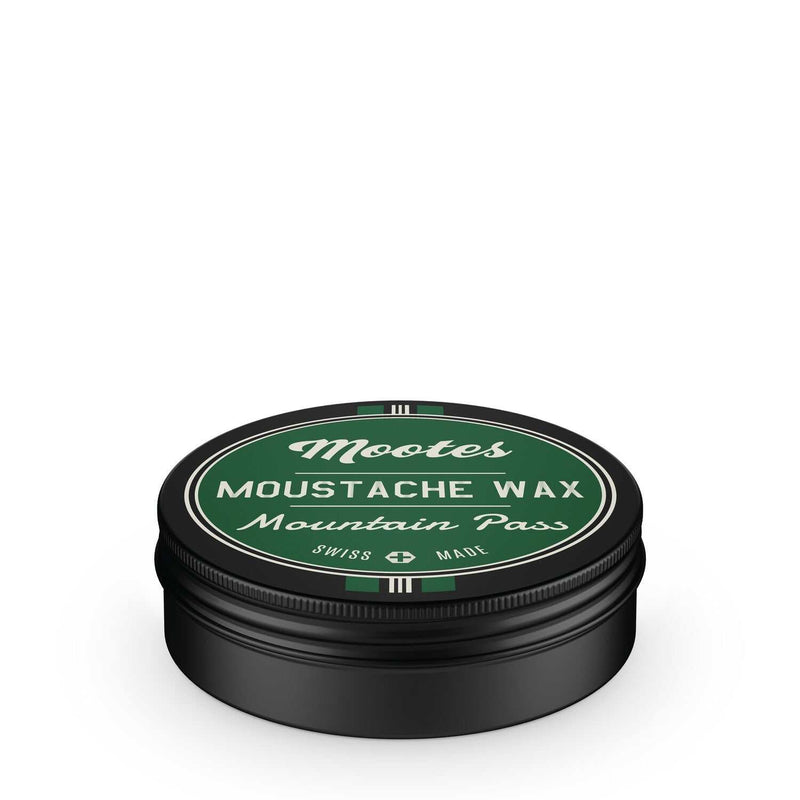 Schwarze Dose mit grünem Deckel und Schriftzug Schnauzwachs Mountain Pass von Mootes, natürliche und schweizerische Herstellung, Bienenwachs und ätherische Öle für glänzenden, wohlriechenden Moustache